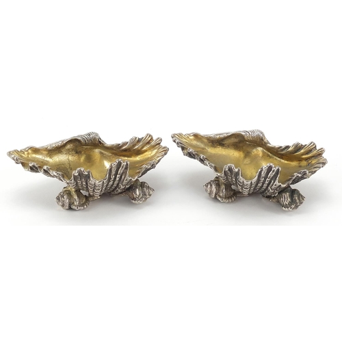 100 - Pair of heavy silver plated shell shaped salts, indistinct hallmarks, 12cm wide, 510.8g