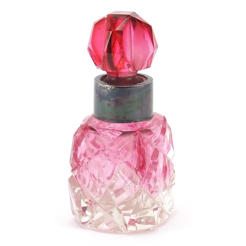 84 - Cranberry cut glass scent bottle with silver collar, London import marks for Simon & Adler, 8cm high