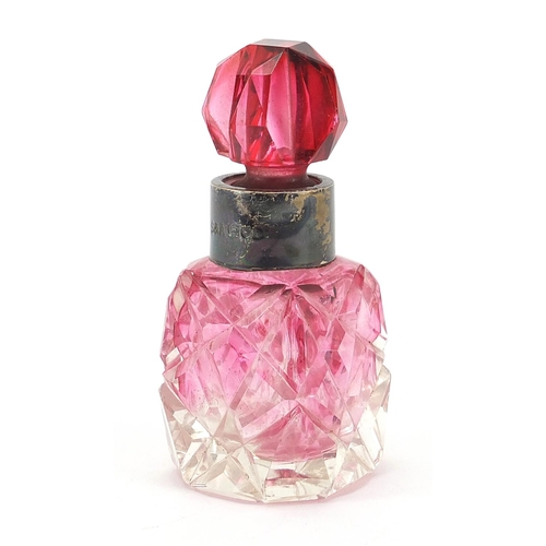 84 - Cranberry cut glass scent bottle with silver collar, London import marks for Simon & Adler, 8cm high