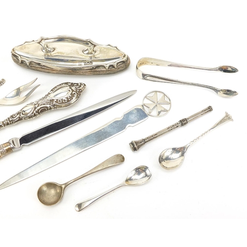 69 - Silver objects including a Maltese letter opener, mustard spoons and sugar tongs, various hallmarks,... 