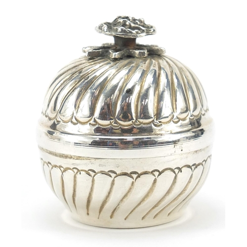 77 - Circular silver box and cover with rose head knop, stamped 900 to the interior, 6cm high, 81.6g