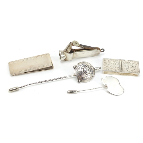 61 - Silver objects including cigar cutter, stamp case and letter clip, the largest 10.5cm in length, 61.... 