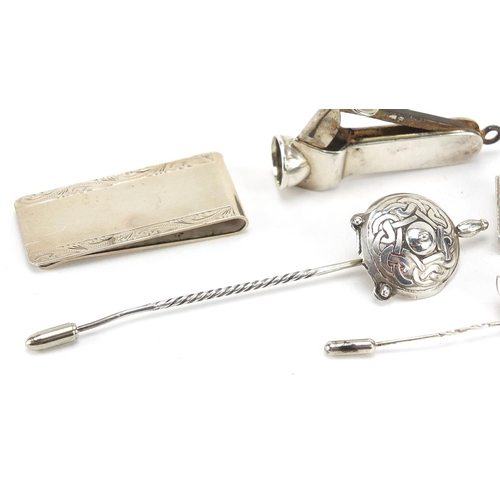 61 - Silver objects including cigar cutter, stamp case and letter clip, the largest 10.5cm in length, 61.... 
