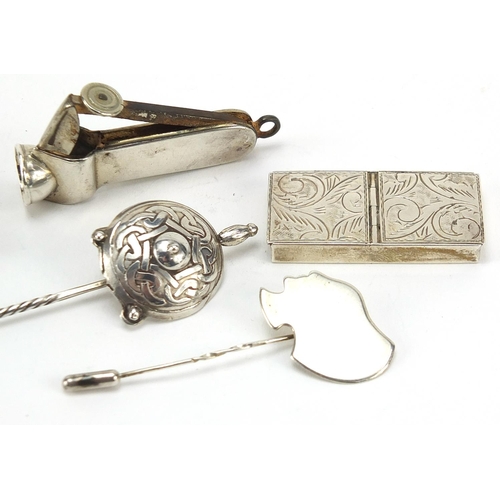 61 - Silver objects including cigar cutter, stamp case and letter clip, the largest 10.5cm in length, 61.... 