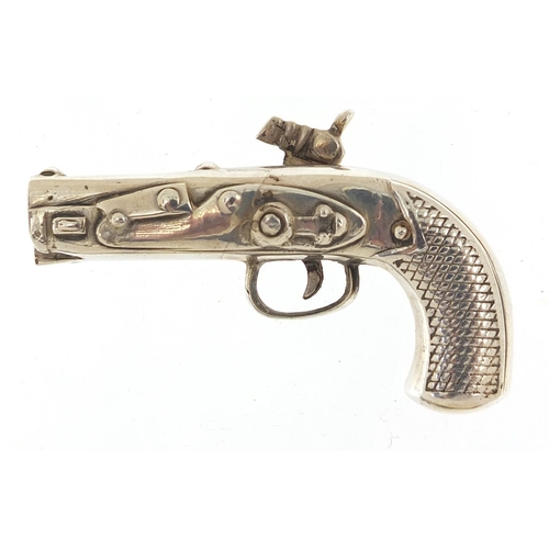 55 - Heavy silver model of a percussion pistol, 7.8cm in length, 89.0g