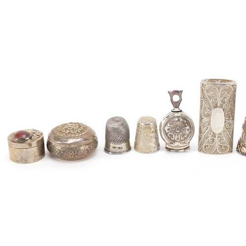 63 - Collection of silver and white metal trinkets, patch boxes and thimbles, the largest 5cm wide, total... 