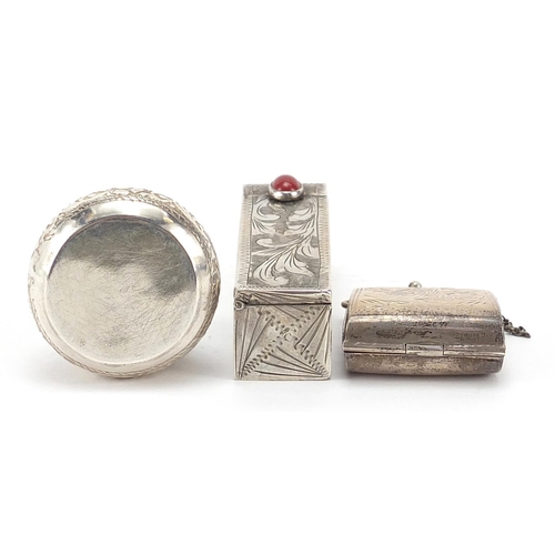 32 - Rectangular silver lipstick case with mirror and two silver pill boxes, the largest 5.5cm in length,... 