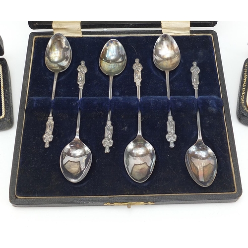 65 - Set of six silver apostle teaspoons and two other silver spoons, each with fitted cases, the largest... 