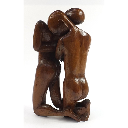 1004 - Modernist wood carving of an embracing couple, 60cm high