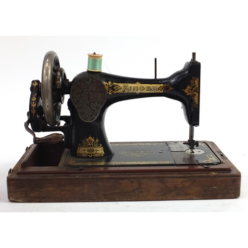 2087 - Victorian black enamel Singer sewing machine with mahogany case, numbered S2293131, 43cm in length