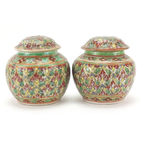 1026 - Pair of Chinese porcelain vases and covers hand painted with flowers, each 7cm high