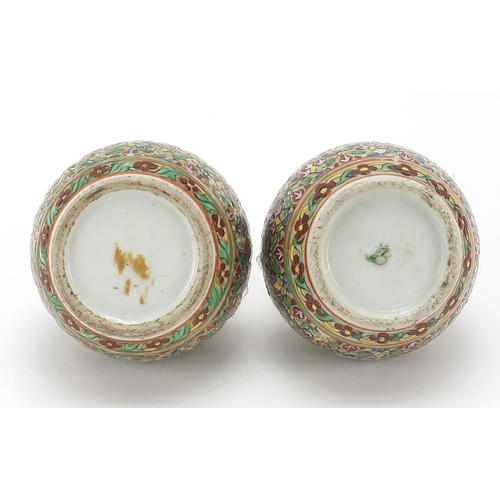 1026 - Pair of Chinese porcelain vases and covers hand painted with flowers, each 7cm high