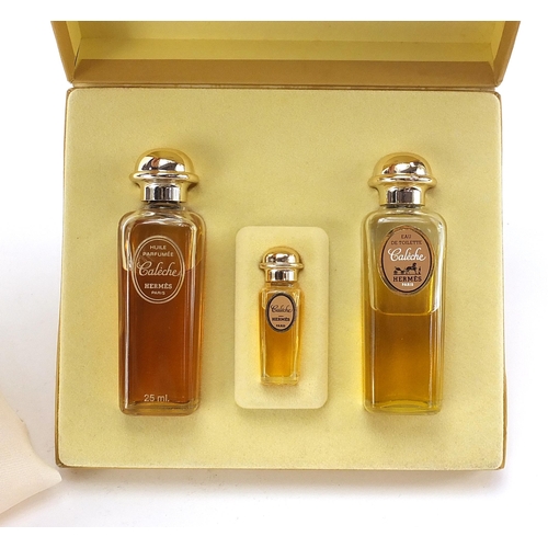 1038 - Set of three Hermes perfumes with fitted box and a Caleche silk handkerchief, 42cm x 42cm