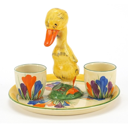 986 - Clarice Cliff, Art Deco egg cup stand with two egg cups hand painted in the crocus pattern, the stan... 