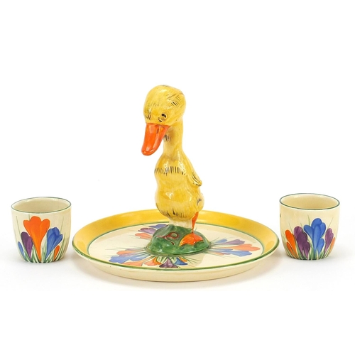 986 - Clarice Cliff, Art Deco egg cup stand with two egg cups hand painted in the crocus pattern, the stan... 