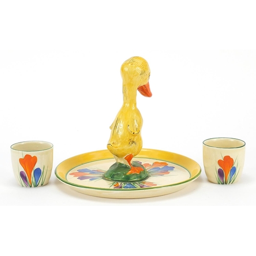 986 - Clarice Cliff, Art Deco egg cup stand with two egg cups hand painted in the crocus pattern, the stan... 