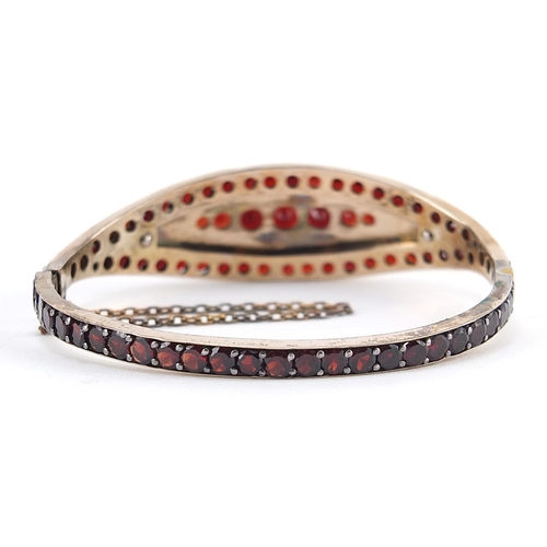 183 - Antique unmarked gold Bohemian garnet hinged bangle with fitted tooled leather box, 6.2cm wide, 17.0... 