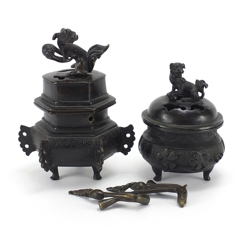 981 - Two Japanese patinated bronze tripod incense burners and covers, the largest 16cm high