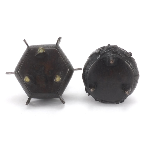 981 - Two Japanese patinated bronze tripod incense burners and covers, the largest 16cm high