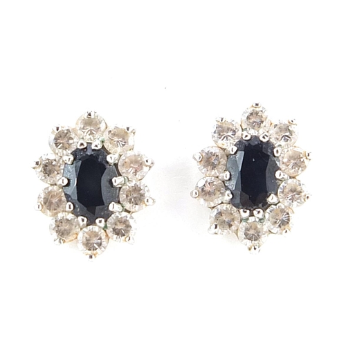 174 - Pair of unmarked 9ct gold sapphire and clear stone cluster stud earrings, 1.2cm high, 1.4g