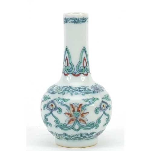 2094 - Chinese doucai porcelain vase hand painted with flower heads amongst scrolling foliage, six figure c... 