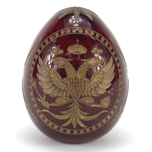 892 - Russian red glass egg paperweight in the style of Faberge, etched with double headed eagle and sword... 