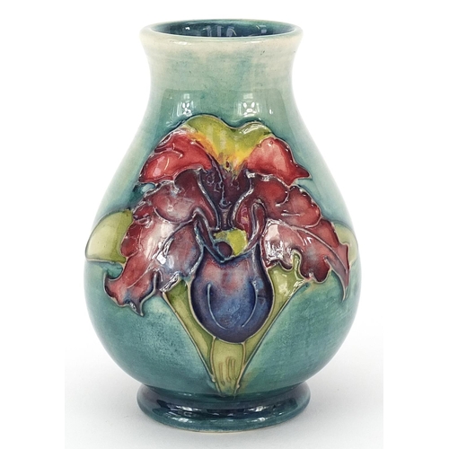 990 - Moorcroft Pottery baluster vase hand painted with two flowers, paper label to the base, 10cm high