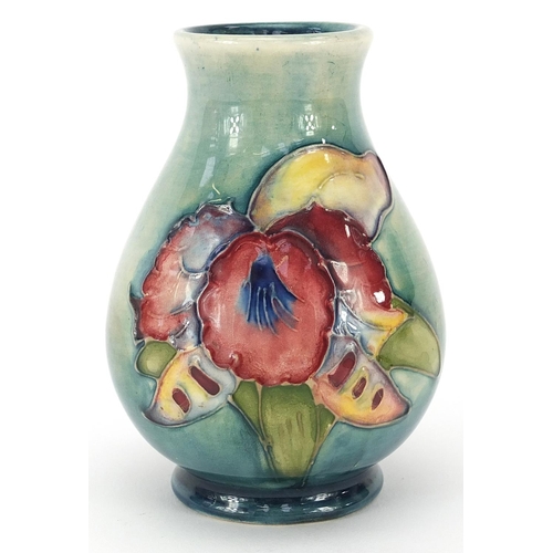 990 - Moorcroft Pottery baluster vase hand painted with two flowers, paper label to the base, 10cm high