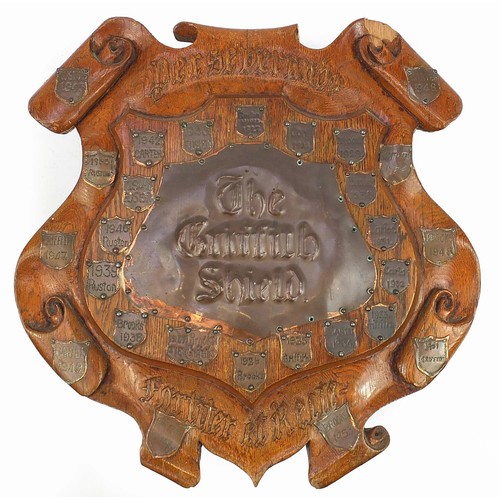 1003 - Large Arts & Craft oak shield carved Perseverando Fortiter et Recte, the copper plaques embossed The... 