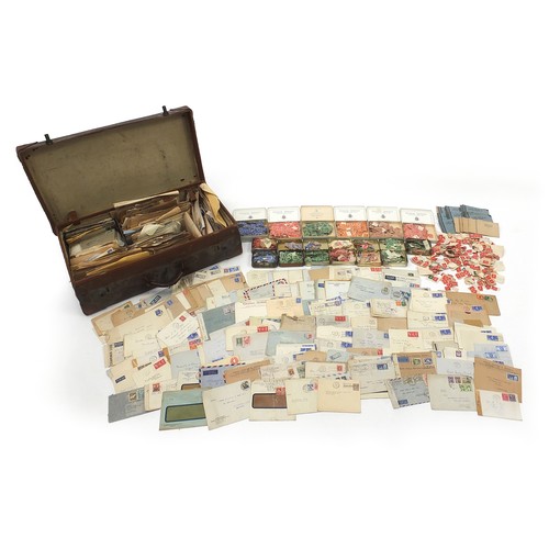 61 - Extensive collection of world stamps and postal history arranged in a vintage suitcase, 65cm wide