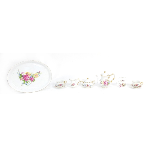 257 - Miniature floral china tea for two set, the tray 25cm in diameter