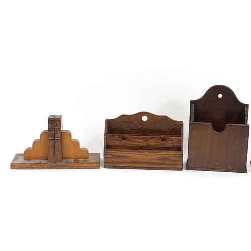 21 - Two pairs of wooden bookends, wooden letter racks and a retro metal letter rack, the largest 24cm wi... 