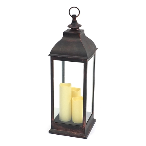 128 - Floor standing battery operated candle lantern, 70cm high