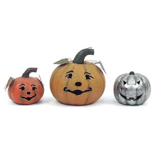 167 - Three metal garden pumpkin lanterns, the largest 37cm high