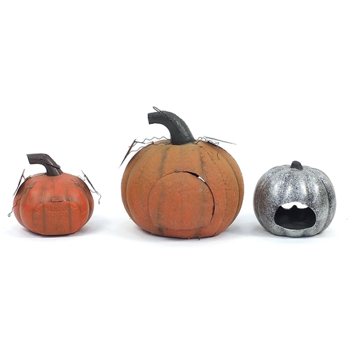 167 - Three metal garden pumpkin lanterns, the largest 37cm high