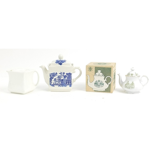 180 - Three collectable teapots including a cubed teapot, blue and white Willow pattern and a boxed Mensa ... 