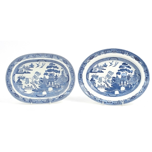 181 - Pair of Wedgwood blue and white Willow pattern meat plates, the largest 32cm wide