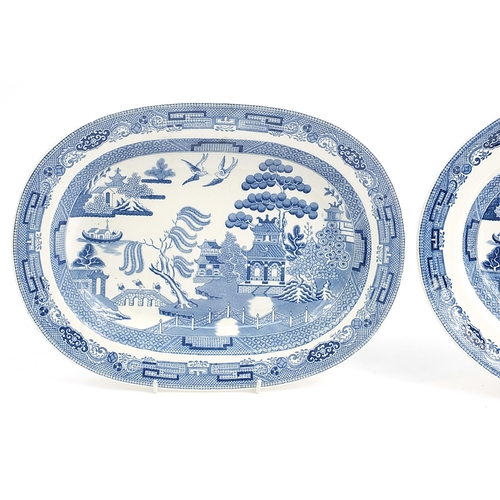 181 - Pair of Wedgwood blue and white Willow pattern meat plates, the largest 32cm wide