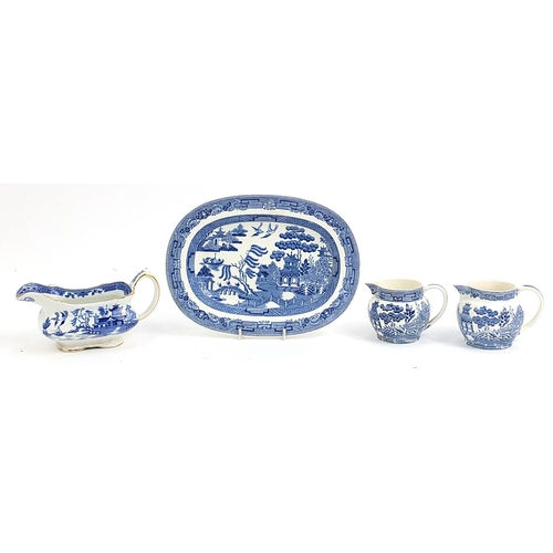 77 - Wedgwood blue and white Willow pattern including two jugs, sauce boat and meat plate, the largest 26... 