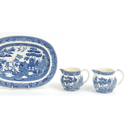 77 - Wedgwood blue and white Willow pattern including two jugs, sauce boat and meat plate, the largest 26... 