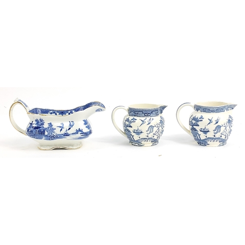 77 - Wedgwood blue and white Willow pattern including two jugs, sauce boat and meat plate, the largest 26... 