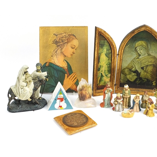 225 - Religious items including ceramic nativity scene, angels and wooden ikons, the largest 40cm high