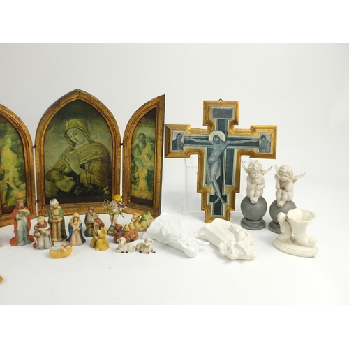 225 - Religious items including ceramic nativity scene, angels and wooden ikons, the largest 40cm high