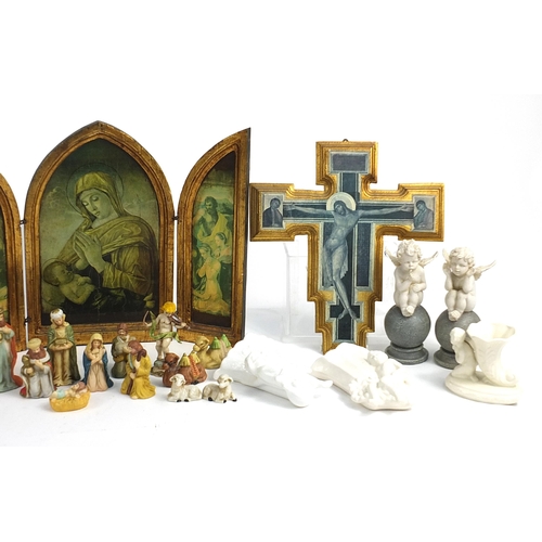 225 - Religious items including ceramic nativity scene, angels and wooden ikons, the largest 40cm high