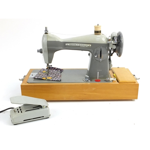 100 - Cased Frister Rossman electric sewing machine