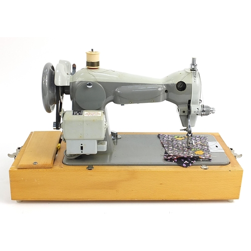 100 - Cased Frister Rossman electric sewing machine