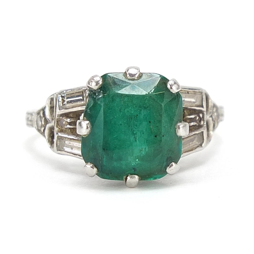 61 - Art Deco platinum emerald ring with diamond set shoulders, the emerald 10mm H x 9.3mm W x 4.1mm D, s... 