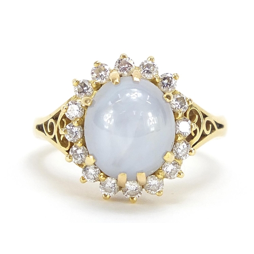 5 - 18ct gold cabochon star sapphire and diamond ring with pierced shoulders, size O, 8.3g