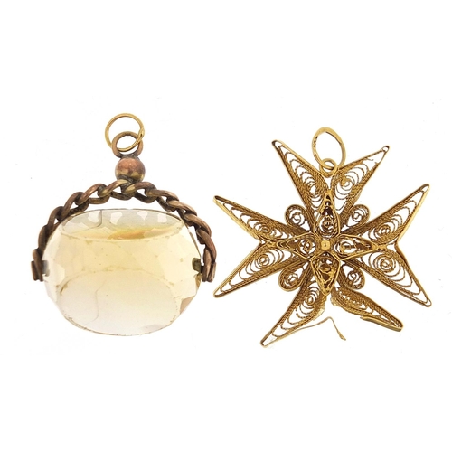 184 - Unmarked gold citrine spinner fob 12.5g and 18ct gold filigree pendant 2.9g, the largest 3.2cm high