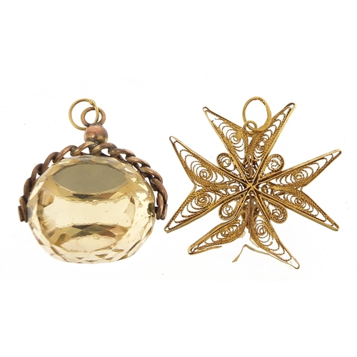 184 - Unmarked gold citrine spinner fob 12.5g and 18ct gold filigree pendant 2.9g, the largest 3.2cm high